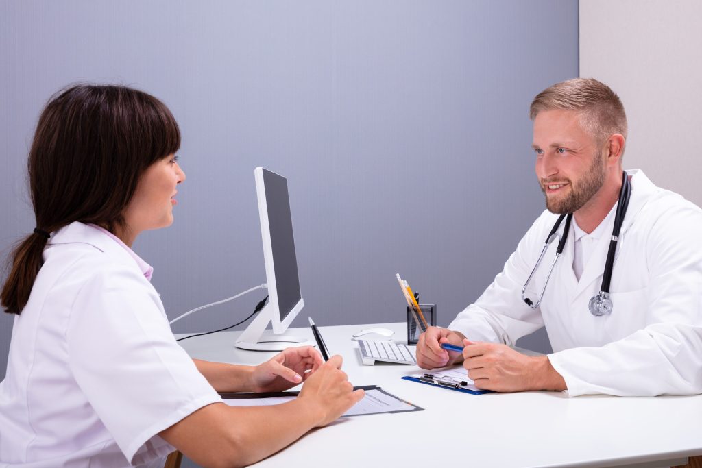 Doctor working with nurse